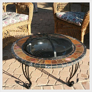 Large picture of an uniflame slate marble firepit copper accents.